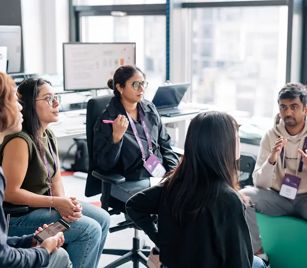 Participants networking and learning at a community meetup